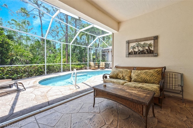 view of pool featuring a lanai and a patio