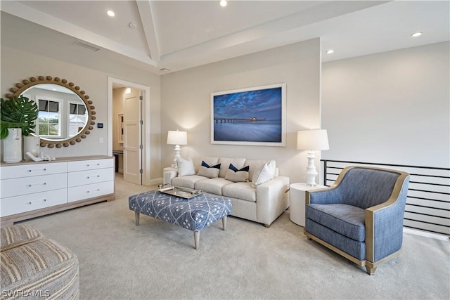 living room featuring beam ceiling and light colored carpet