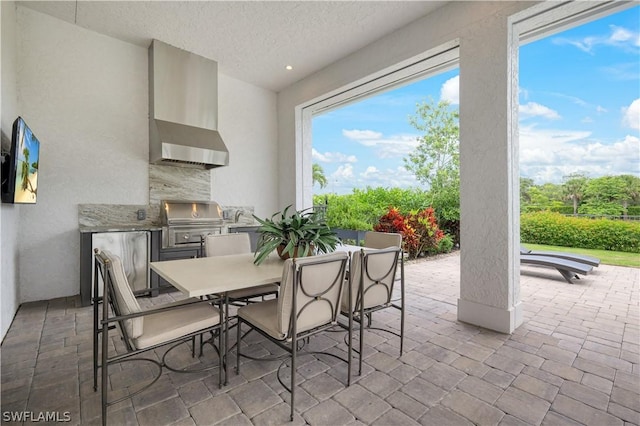 view of patio featuring an outdoor kitchen and area for grilling