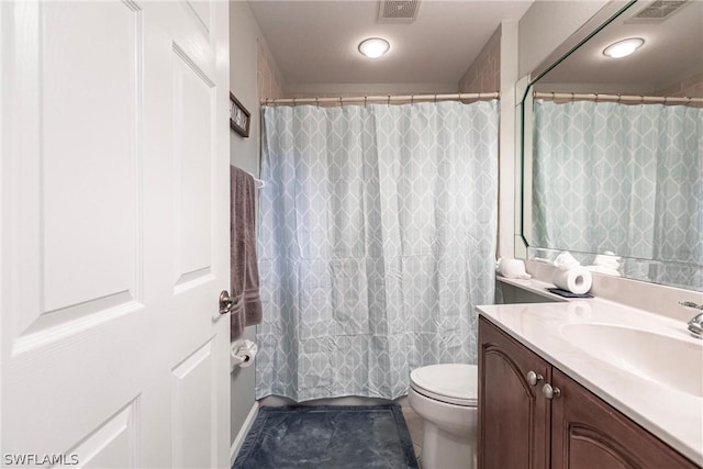 bathroom with toilet, curtained shower, and vanity