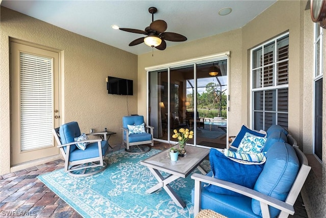 view of patio featuring ceiling fan