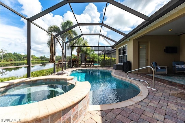 view of swimming pool featuring a patio, glass enclosure, an in ground hot tub, and a water view