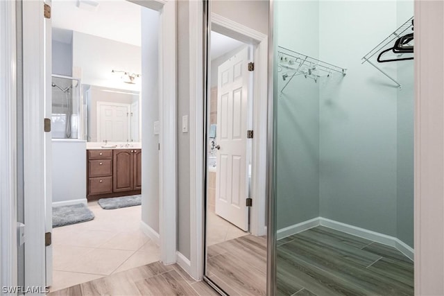 walk in closet featuring light wood-type flooring