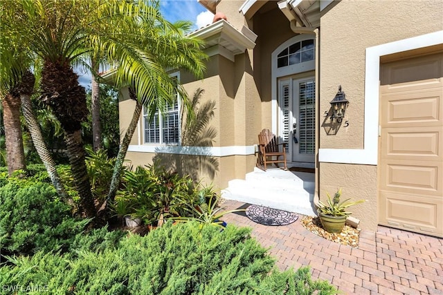 view of exterior entry featuring a garage