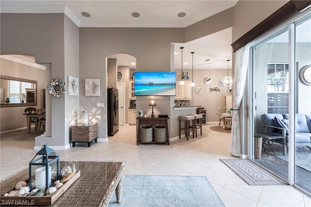 tiled living room featuring crown molding