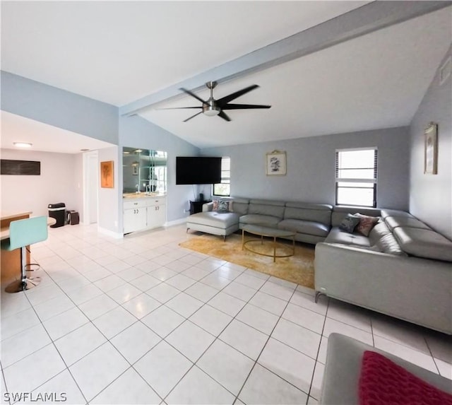 living room with light tile patterned floors, vaulted ceiling with beams, and ceiling fan