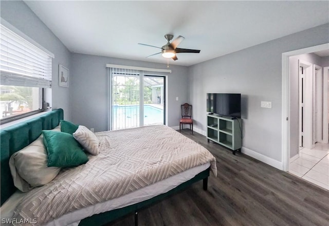 bedroom featuring access to exterior, hardwood / wood-style flooring, and ceiling fan