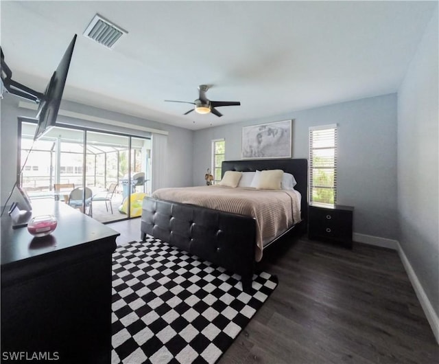 bedroom featuring ceiling fan, dark hardwood / wood-style flooring, and access to exterior