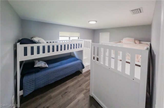 bedroom featuring dark hardwood / wood-style floors