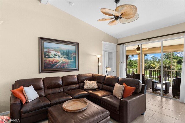 living area featuring light tile patterned flooring, a ceiling fan, and vaulted ceiling