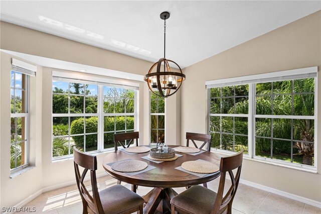 20331 Calice Ct Unit 1704, Estero, FL 33928 - dining area with a chandelier, plenty of natural light, baseboards, and vaulted ceiling