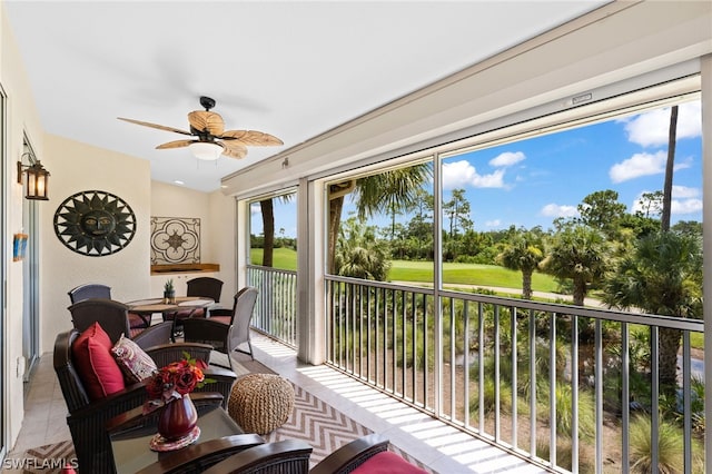 sunroom / solarium with ceiling fan