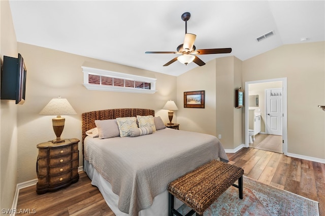 bedroom with visible vents, baseboards, lofted ceiling, and wood finished floors