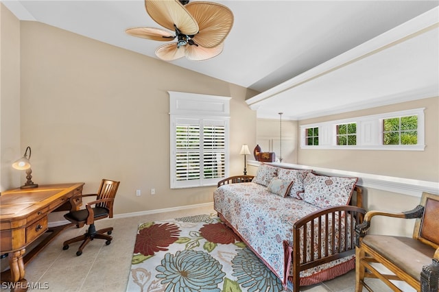 bedroom with ceiling fan, light tile patterned flooring, and lofted ceiling