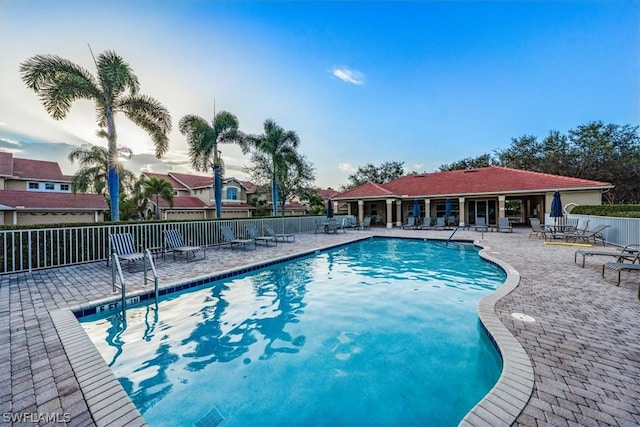 view of swimming pool with a patio