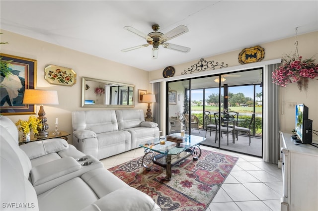 tiled living room with ceiling fan