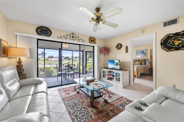 tiled living room with ceiling fan