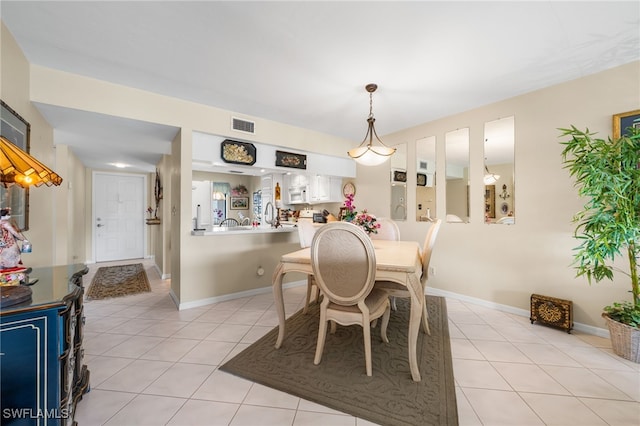 dining room featuring light tile patterned floors