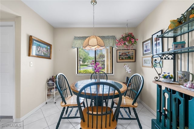 dining area with light tile patterned floors