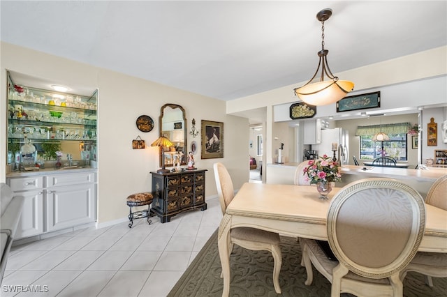 dining area with light tile patterned flooring