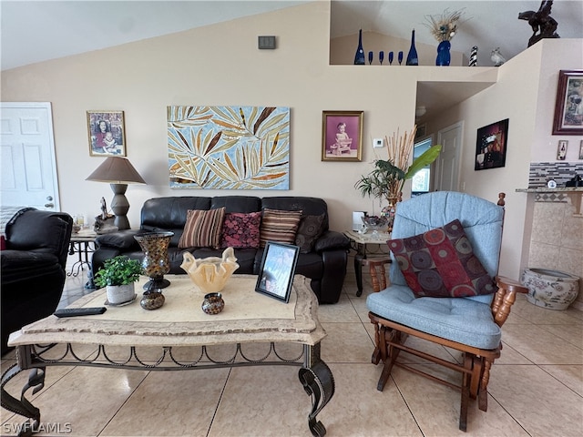 living room with tile patterned floors and lofted ceiling