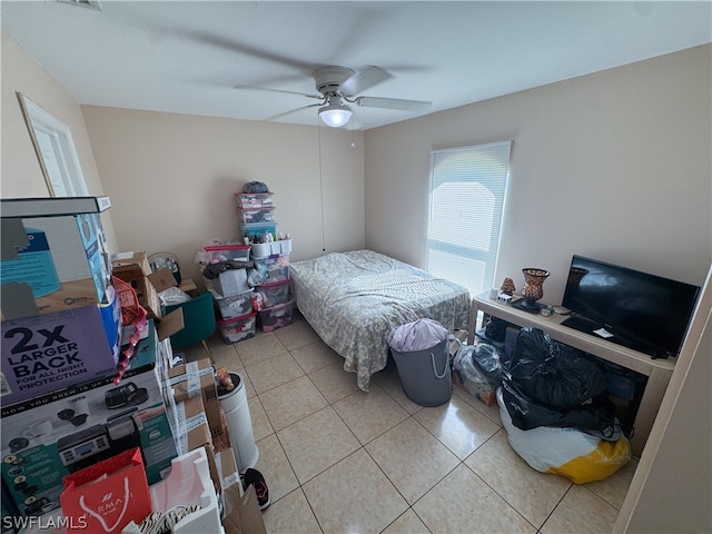 tiled bedroom with ceiling fan