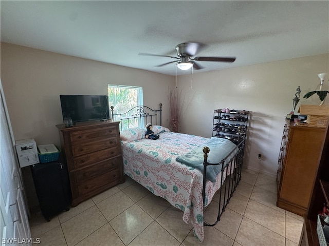 bedroom with light tile patterned floors and ceiling fan