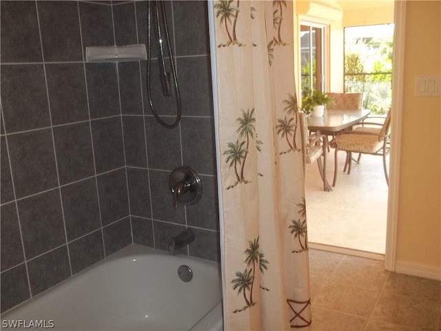 bathroom with tile patterned floors and shower / bath combo