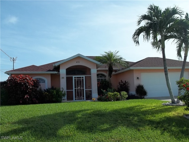 ranch-style house featuring a garage and a front lawn