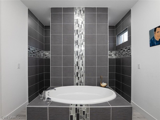 bathroom with tiled tub