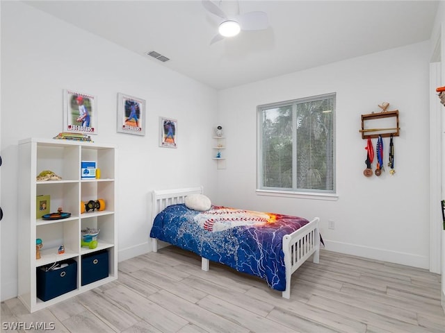 bedroom with hardwood / wood-style floors and ceiling fan