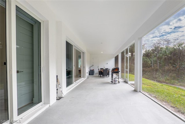 unfurnished sunroom with plenty of natural light