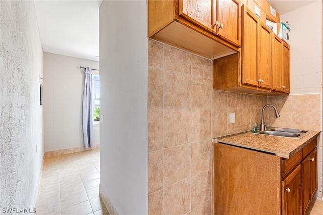 kitchen with sink and light tile patterned floors