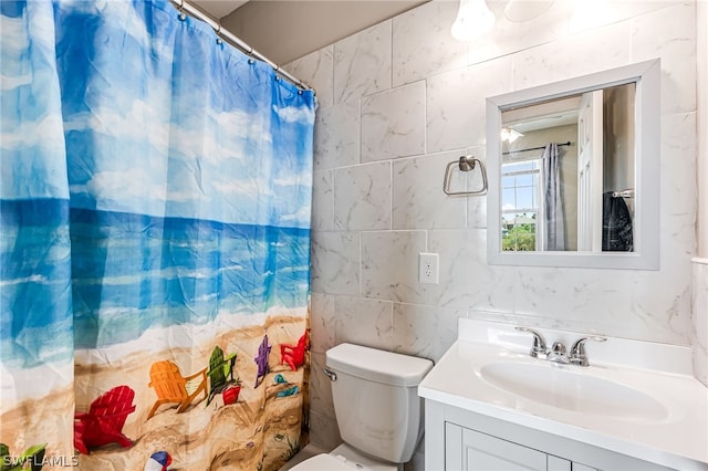 bathroom featuring vanity, curtained shower, and toilet