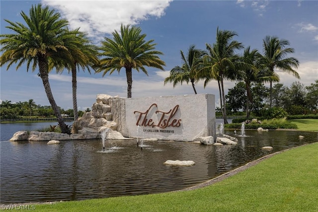 community sign with a water view