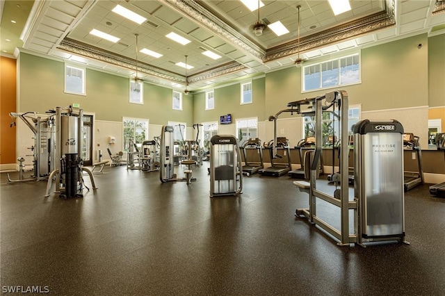 gym featuring a towering ceiling