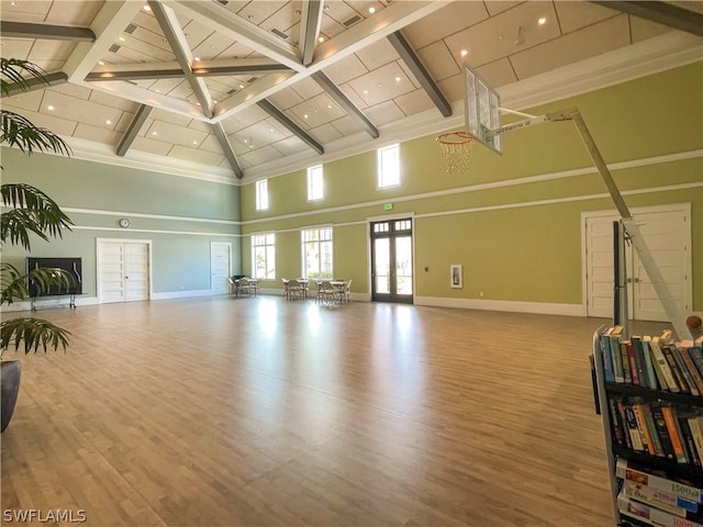 living room featuring beam ceiling, french doors, high vaulted ceiling, and hardwood / wood-style flooring