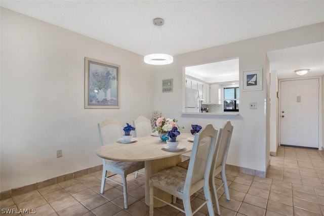 view of tiled dining space