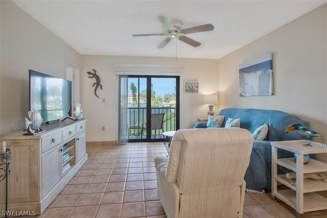 tiled living room featuring ceiling fan