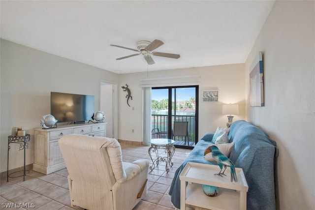 tiled living room with ceiling fan