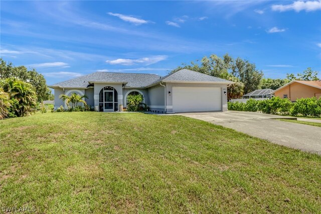 ranch-style home with a front yard and a garage