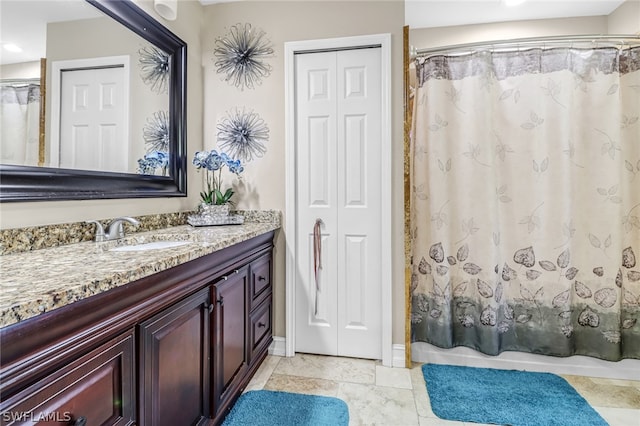 bathroom with a shower with curtain and vanity