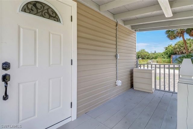 doorway to property featuring covered porch