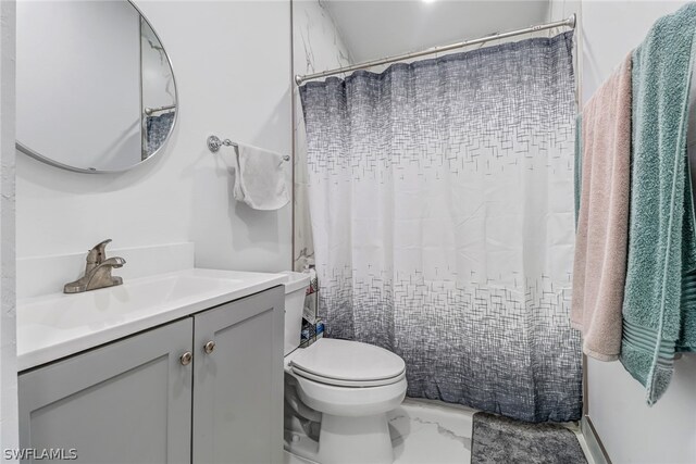 bathroom featuring vanity and toilet