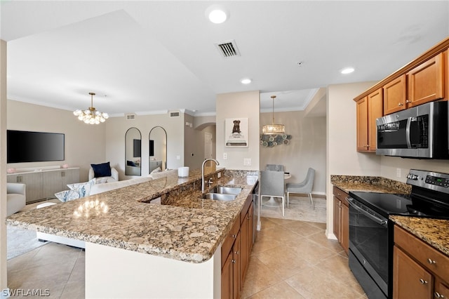 kitchen featuring pendant lighting, sink, light stone counters, appliances with stainless steel finishes, and light tile patterned floors