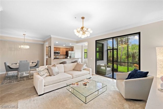 living room featuring a chandelier, tile patterned floors, crown molding, and a wealth of natural light