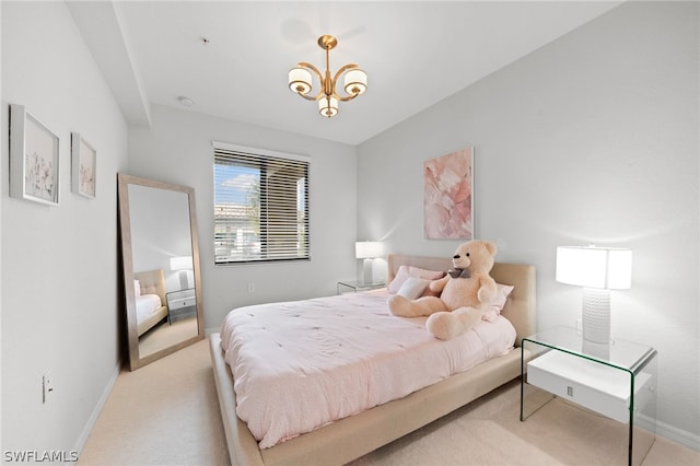 bedroom featuring carpet floors and a chandelier