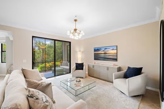 living room featuring a healthy amount of sunlight, crown molding, and a chandelier