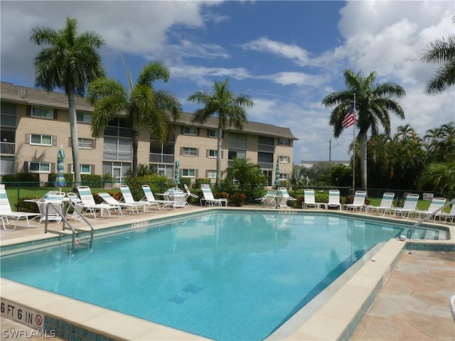 pool featuring a patio area and fence