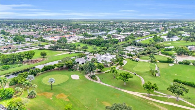 drone / aerial view featuring a water view and view of golf course